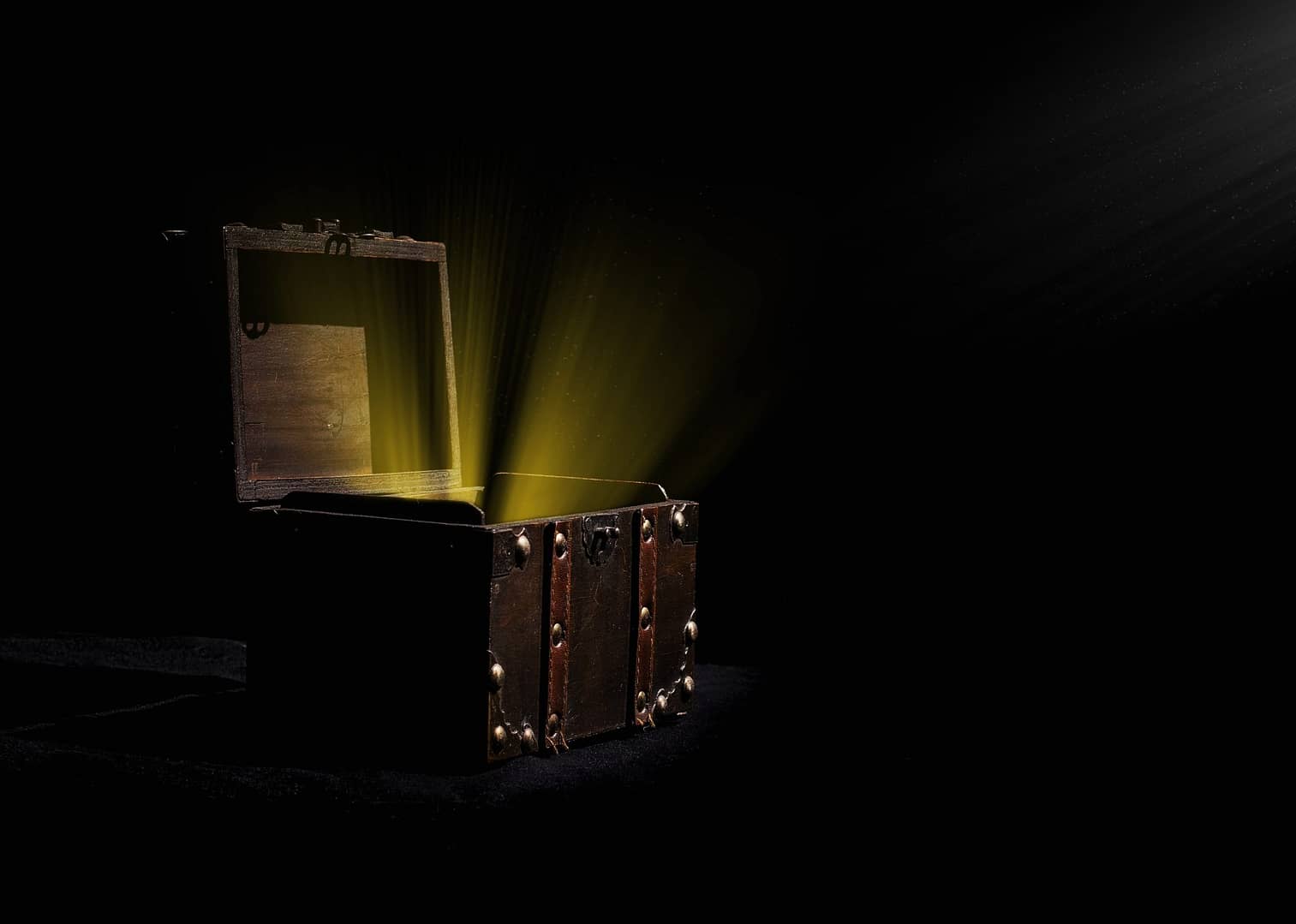 An open treasure chest with light coming out of it